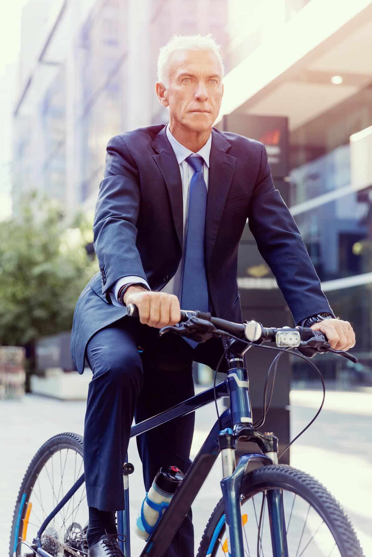 Businessman Riding on Bike