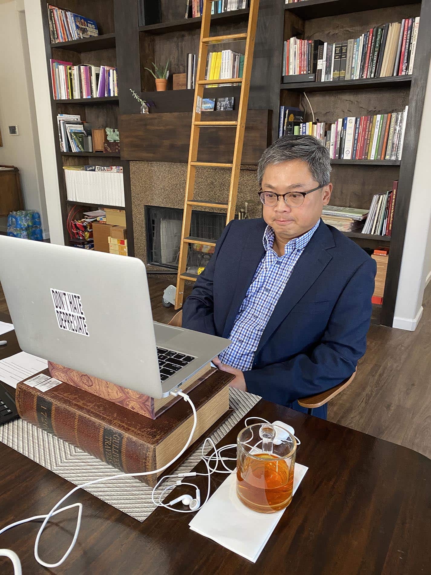 Daniel Cheung Using Laptop at His Desk